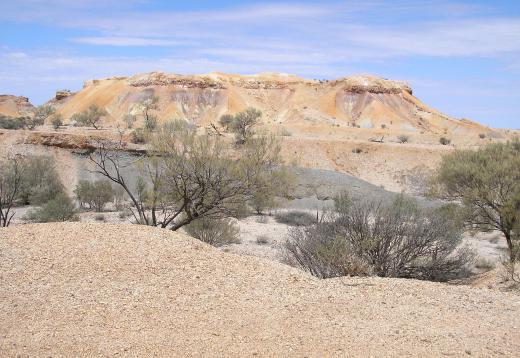 Arid and semi-arid regions do not have enough moisture in the soil to withstand wind erosion.