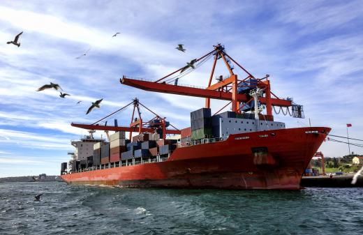 A container ship will noticeably rise in the water as its cargo is offloaded.