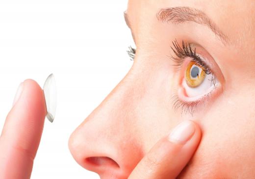 Contact lenses improve vision by refracting incoming light.