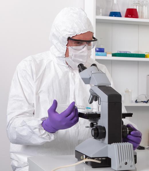 Virologists often wear protective clothing when they work with potentially dangerous organisms in laboratory settings.