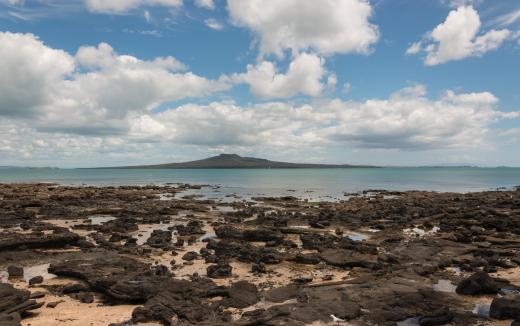 Ocean trenches are most often located parallel to volcanic islands, at the boundary of two tectonic plates.