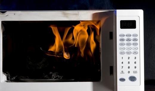 Certain metals like aluminum can create electric arcs and cause fires in microwaves.