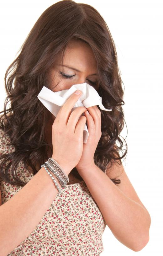 A woman sneezing because of mold.