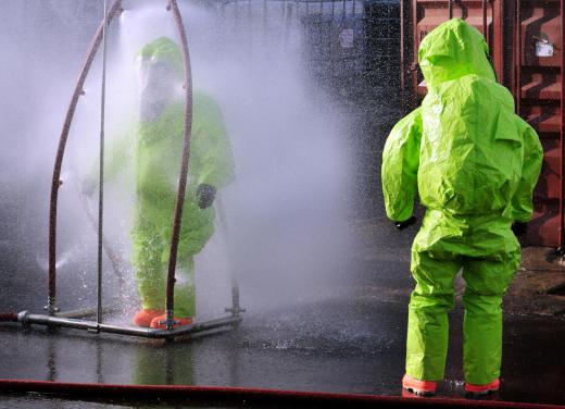 Workers involved with chemical spills wear specialized suits to protect them from hazardous materials.